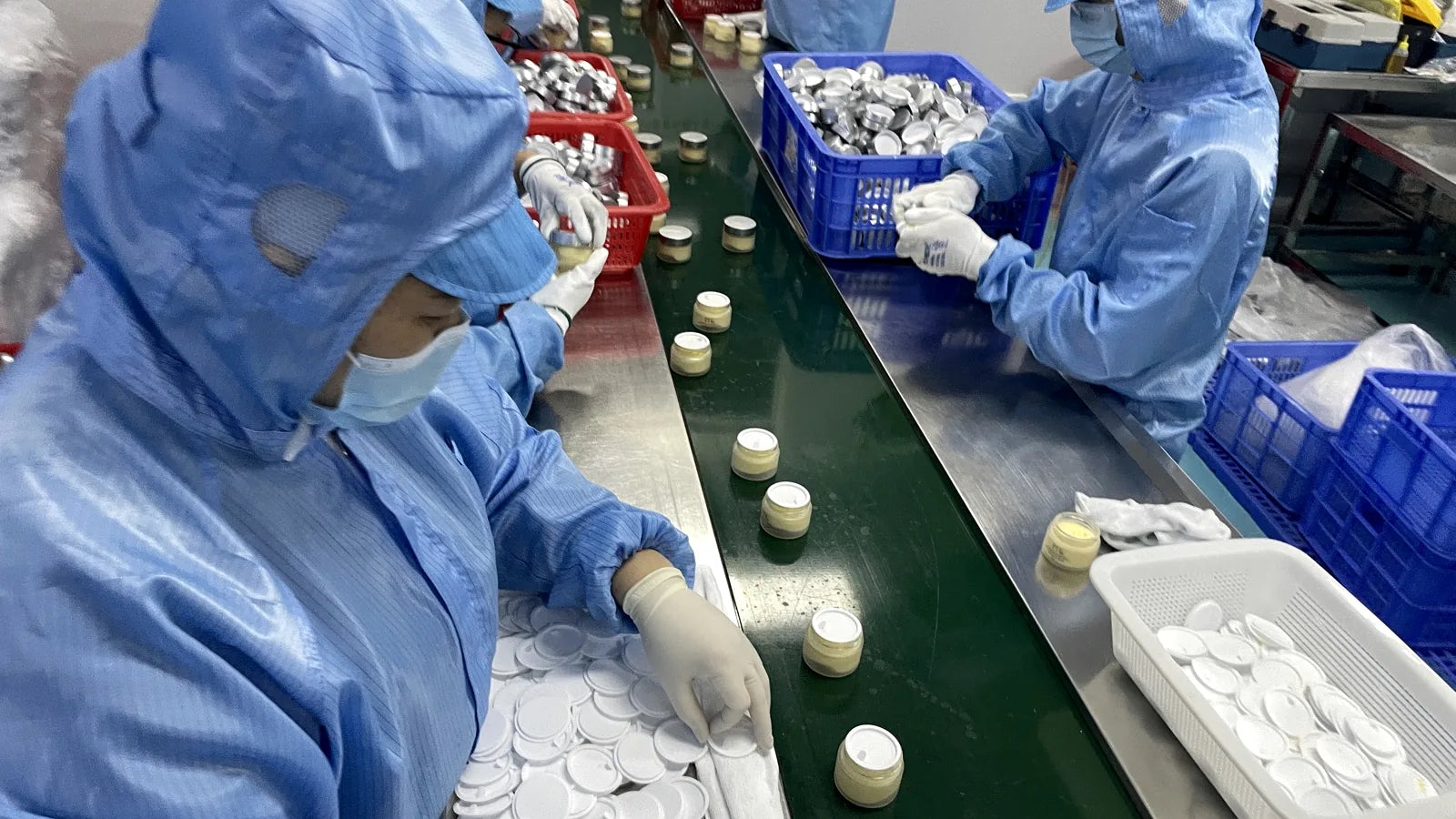 afcare skincare production workshop with filling and packing team